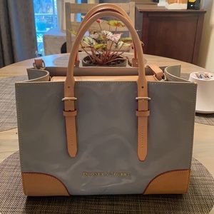 Classic Dooney bag in gray, patent leather.